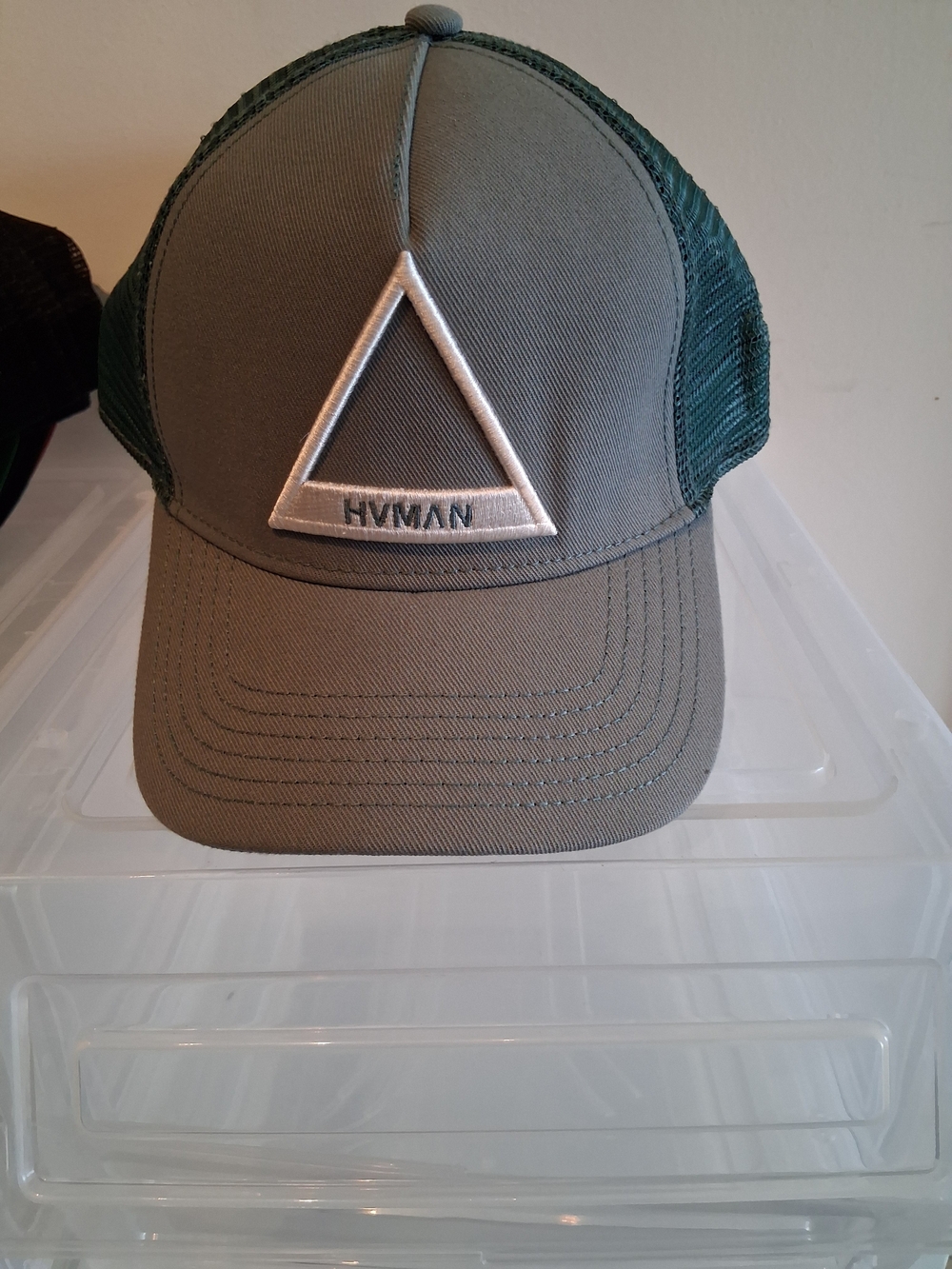 Olive Green Trucker Hat with Embroidered Triangle!